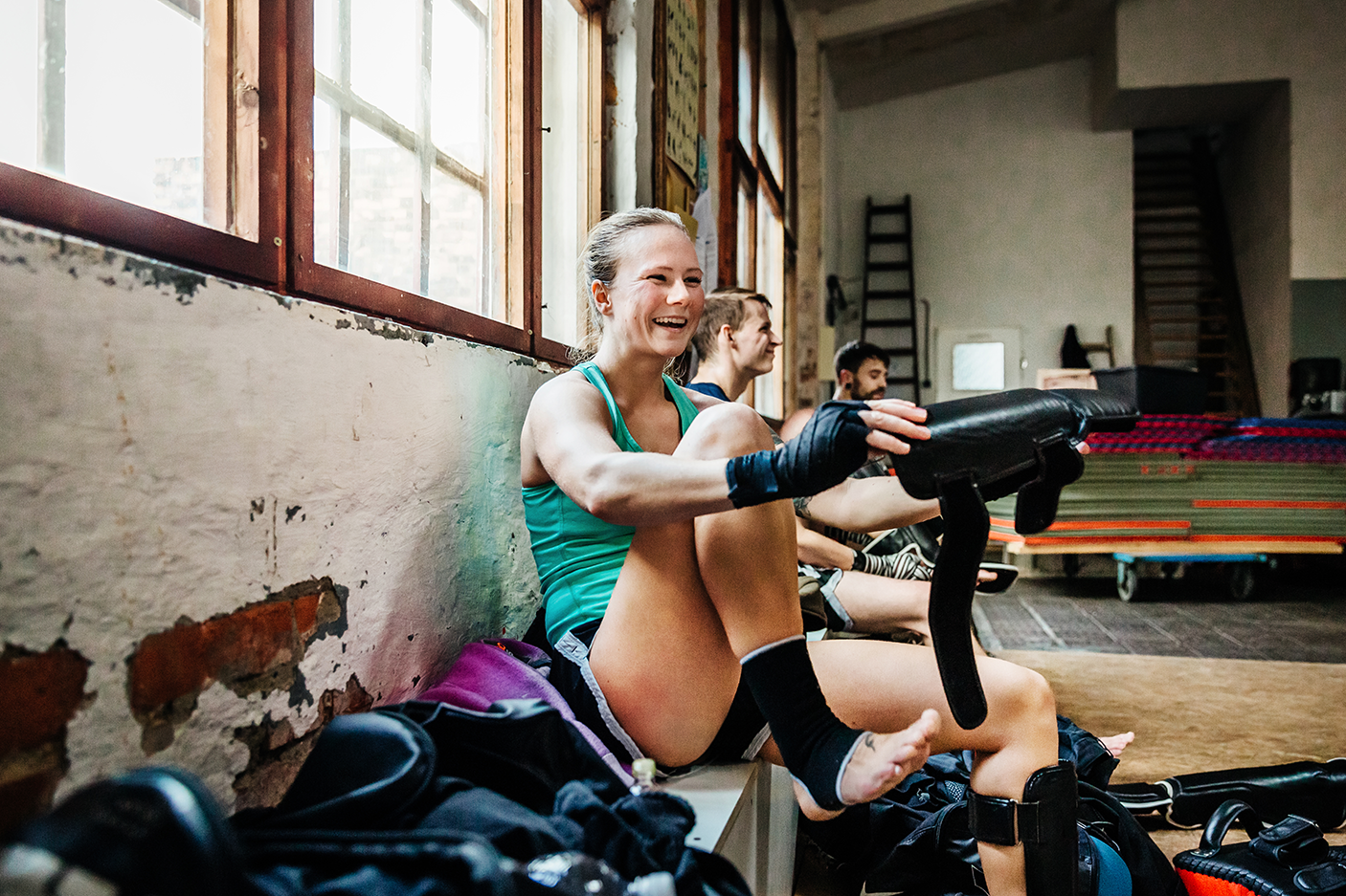 Muay thai boxer putting on protection gear - stock photo