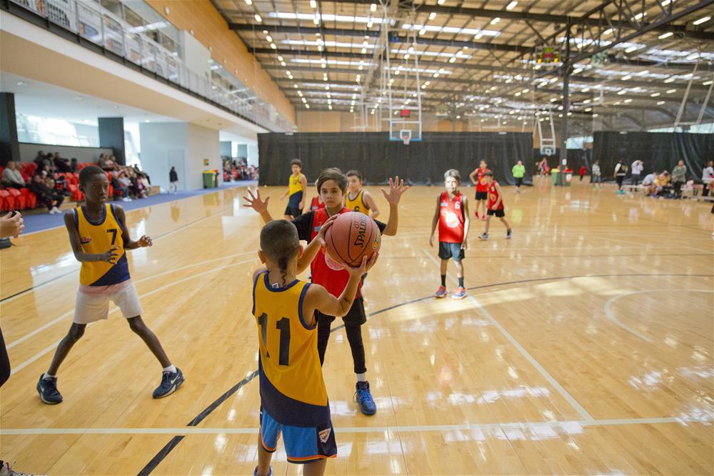 NAIDOC Basketball competition with paricipants playing at the Bendat Basketball Centre